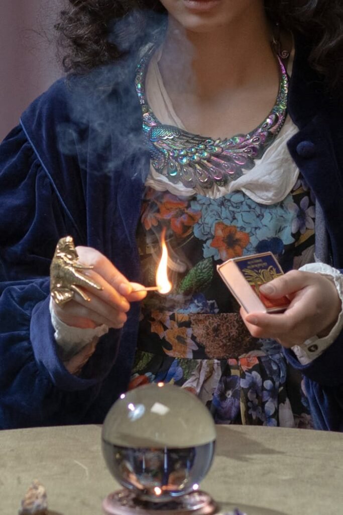 A Person Holding a Burning Matchstick